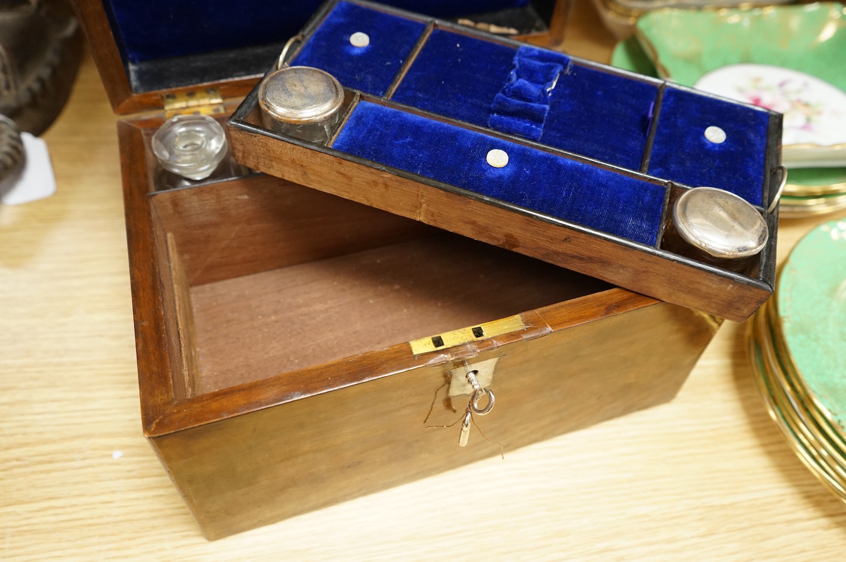 A 19th century walnut toilet box, fitted with glass and plate topped fittings, 27.5cm wide x 17cm high